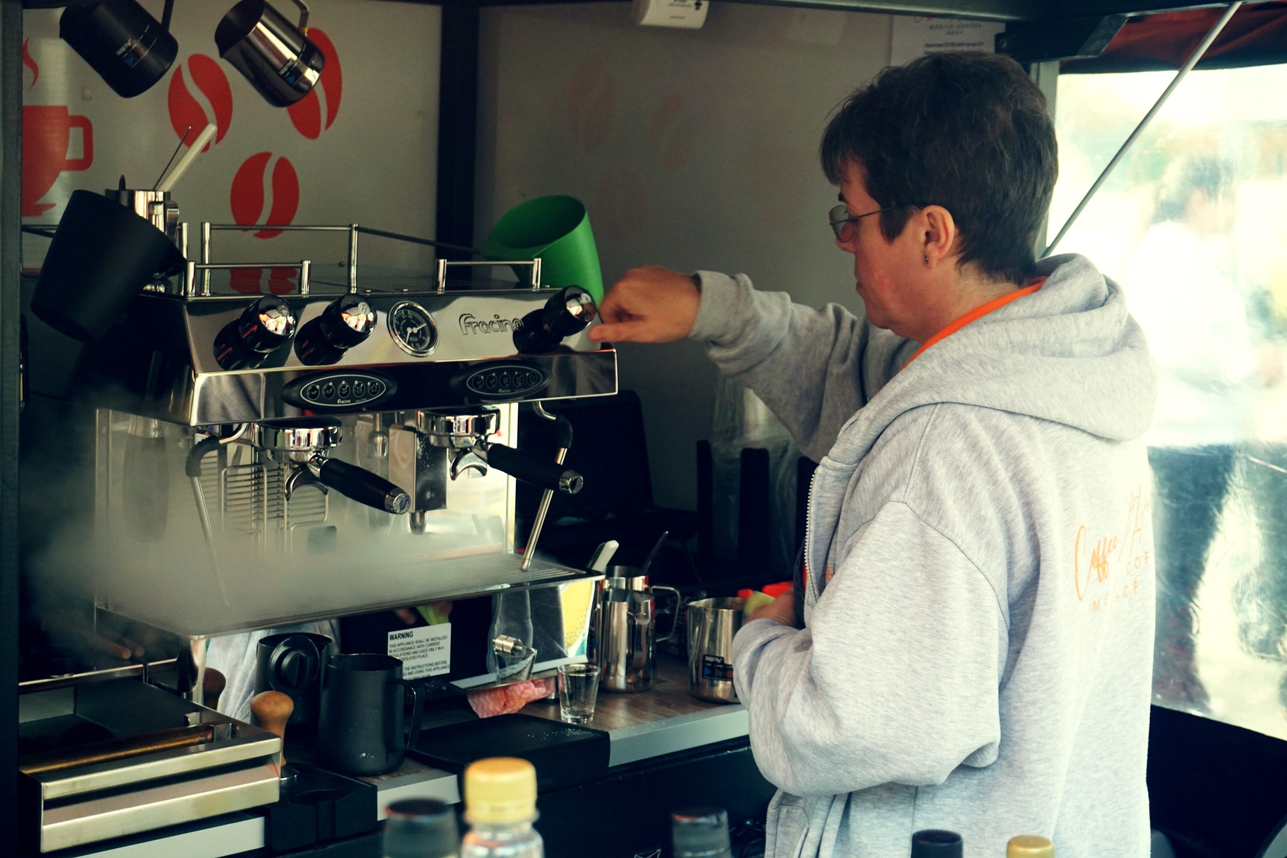 Heather from Coffee At Heathers using her barista coffee machine to generate steam during a cleaning cycle
